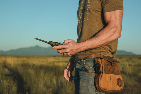 Upland Field Bag with side strap for carrying a dog collar transmitter